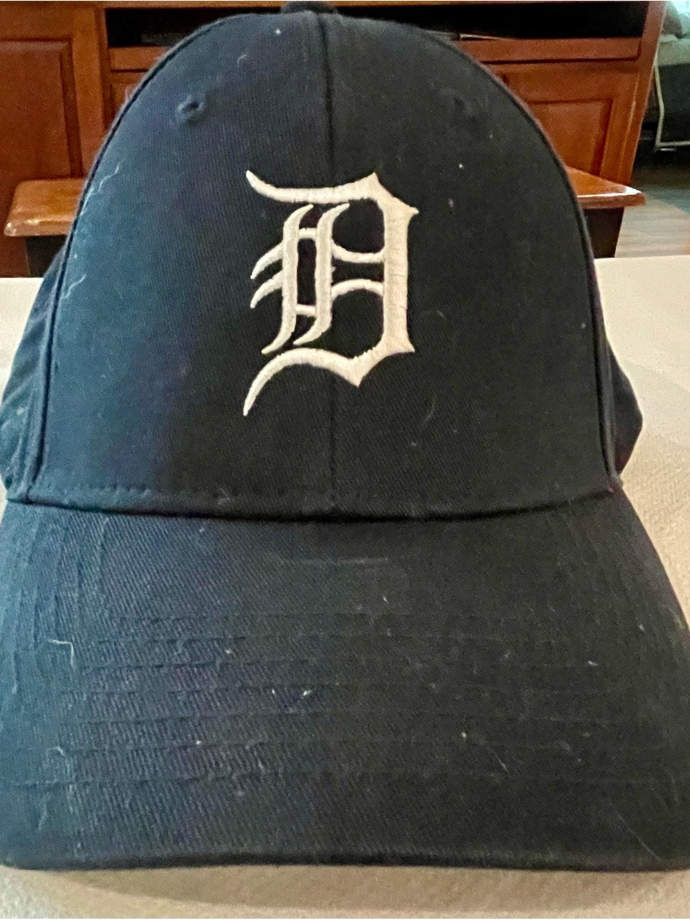 Genuine Merchandise Black Cap with White Logo Tag